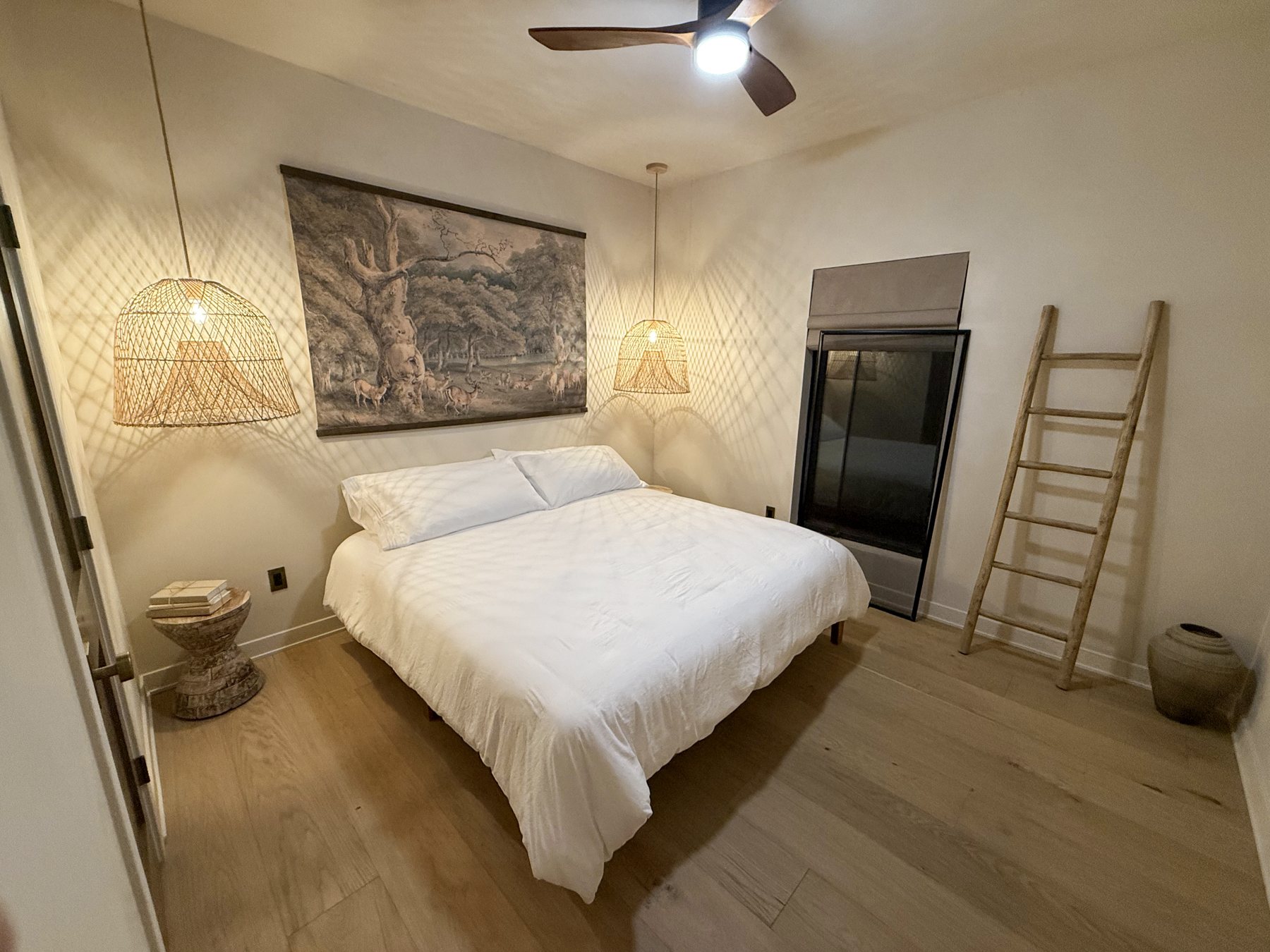 King bedroom with rattan pendants