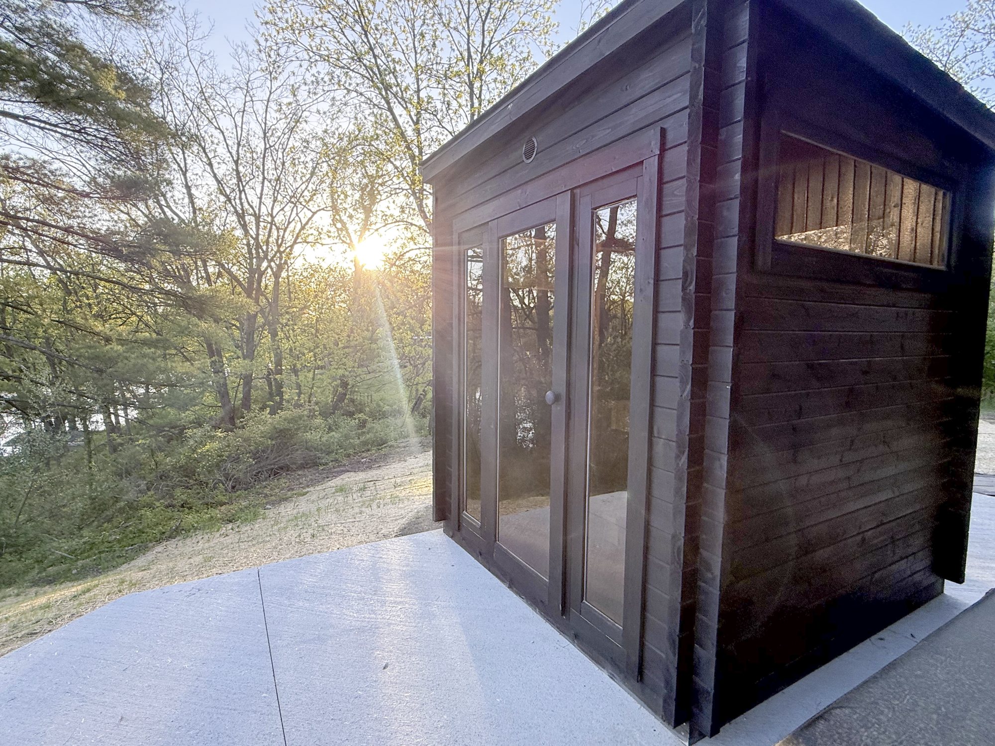 The sauna at sunset above the river